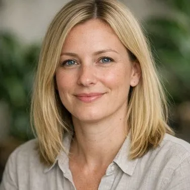 Blonde woman mid-forties, straight shoulder-length hair, calm grey-blue eyes